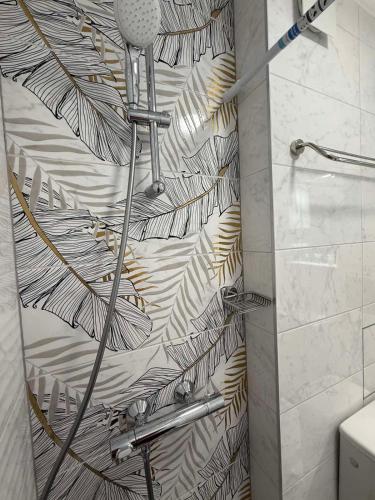 a shower in a bathroom with a shower curtain at Apart hotel Gallery L in Sunny Beach