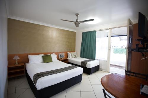 Ένα ή περισσότερα κρεβάτια σε δωμάτιο στο David Motor Inn