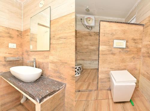 a bathroom with a sink and a toilet at Hotel Ganesh Mahalakshmi Inn in Guntūr