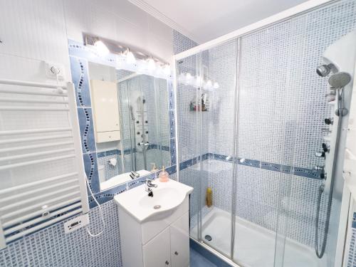 a bathroom with a shower and a sink and a tub at El BALCON DE BAKIO in Bakio