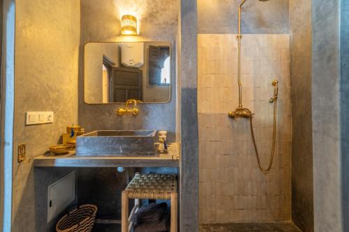 a bathroom with a sink and a shower at Marrakech Medina - Private Riad 4 rooms Rooftop and pools in Marrakesh