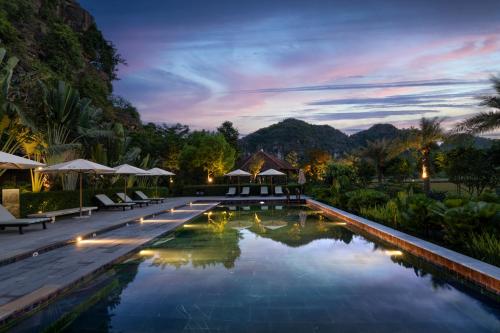a pool at a resort at night at An Hideaway Resort in Ninh Binh