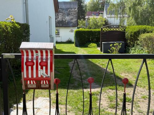 a bird on a grill in a yard at Ferienhaus Präkel in Kloster