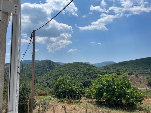 a view of the mountains from a house at Polylimnio landscape in Groustésion