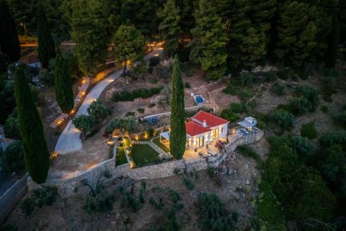 an aerial view of a house with a red roof at Villa Aless in Skopelos Town