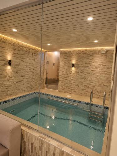 a large swimming pool in a room with at منتجع الفيا - مسابح in Abha