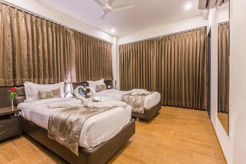 Ένα ή περισσότερα κρεβάτια σε δωμάτιο στο Prominent Corporate Residency
