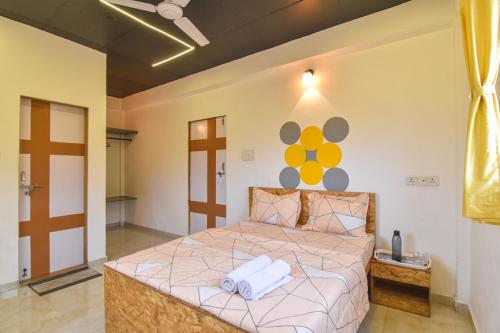 a bedroom with a large bed in a room at II JAGUAR VILLA lI in Lonavala