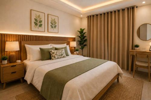 a bedroom with a large bed and a desk at 2BR Sunset View House in Coron Town Proper in Coron