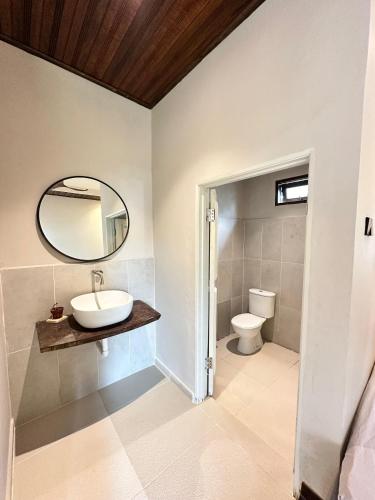 a bathroom with a sink and a toilet at Rumah Seruni@Zaki's Residence in Kampong Ru Lima