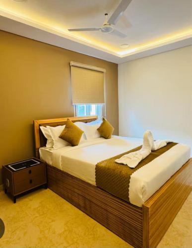 a bedroom with a large bed and a window at Alwar stay in Alwar