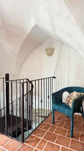 a room with a blue bench on a staircase at B&B Vernole1713 in Vernole