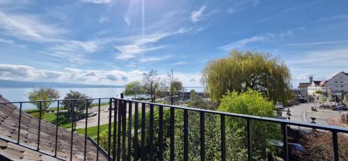 a balcony with a view of the water at Gästehaus Seeblick in Langenargen