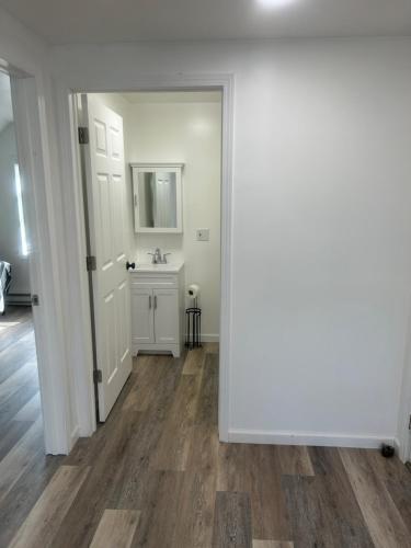 an empty room with a sink and a mirror at Loft Apartment by the River Fort Edward in Fort Edward