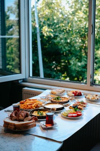 a table with many plates of food on it at Fisi & Wellness Exclusive Villa with Spa Vibes in Stavromenos