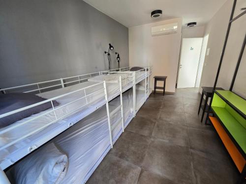 a room with two bunk beds in a room at SUBTUB Hostel Makarska in Makarska