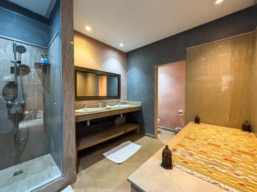a bathroom with a shower and a sink at Riad Azia in Marrakesh