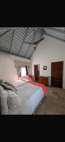 a bedroom with a large bed in a room at Reef Winds Villa in Runaway Bay