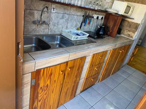 a kitchen with a sink and a counter top at Keetmanshoop Self-catering in Keetmanshoop