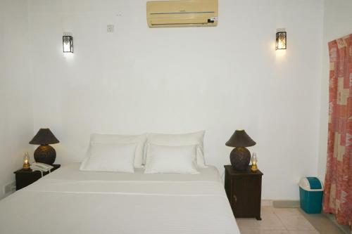 Tempat tidur dalam kamar di Liana Private Villa near Tangalle Beach