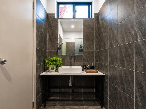a bathroom with a sink and a mirror at YUSETH Private Villa in Phumi Ta Phul