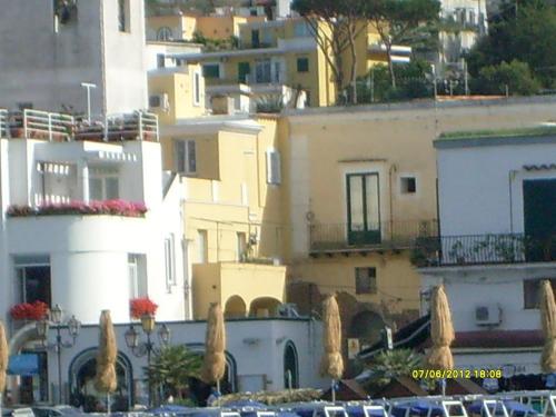 a group of buildings with trees in front of them at B&B Celestina Ischia in Ischia