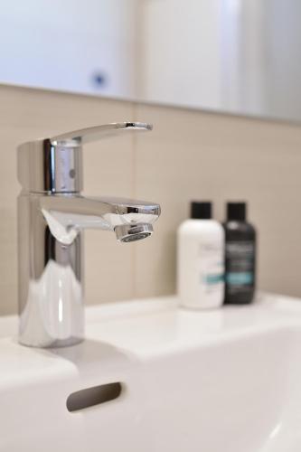 a bathroom sink with a faucet on a counter at Dalmatian Stone House in Baška Voda