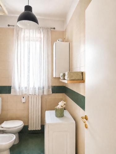 a bathroom with a toilet and a sink at Casa Moscati in Avellino