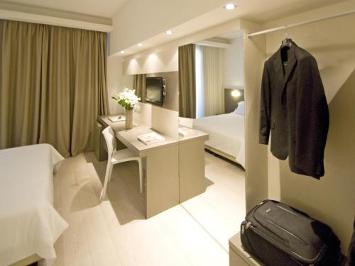 Postel nebo postele na pokoji v ubytování Hotel Cube