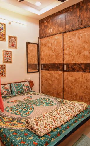 a bedroom with a bed with a pattern on it at 1 BHK by Agartha Atithya in Hyderabad
