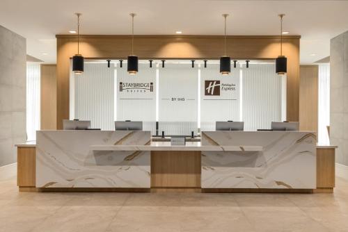 a lobby with a large table and chairs at Holiday Inn Express Houston Downtown by IHG in Houston