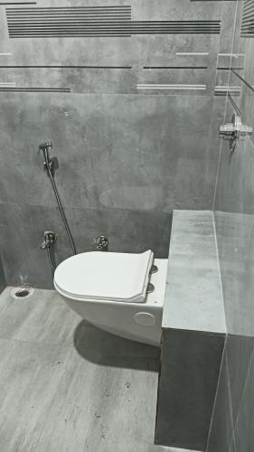a bathroom with a toilet sitting on a counter at Hotel Janki Inn in Deoghar
