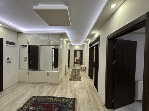 a hallway of a house with a door and a rug at Göreme Apartment in Göreme