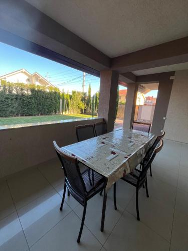 a table and chairs on a balcony with a view at Casa Daria Oradea in Oradea