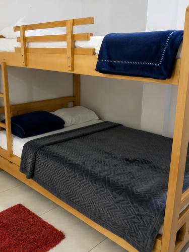 two bunk beds in a room with a bed at Apto Albor Blanco in Popayan