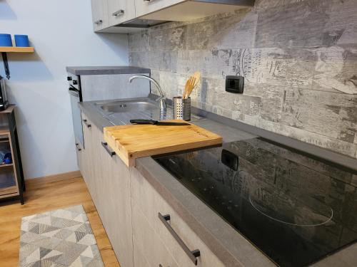 a kitchen with a sink and a counter top at The Blue Gem in Acqui Terme