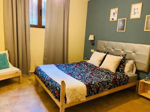a bedroom with a large bed in a room at Apartamento Turístico Snow Boutique in Camarena de la Sierra