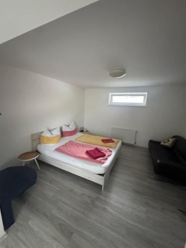a bedroom with a large bed in a room at Pod Kyčarou in Čabalovce
