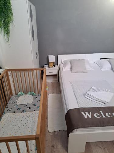 a bedroom with a bed and a bench next to it at Peron 4-City & Station Stay in Rijeka