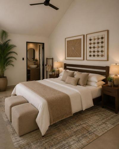 a large bedroom with a large bed and a ceiling fan at Casa Dega in Balapitiya