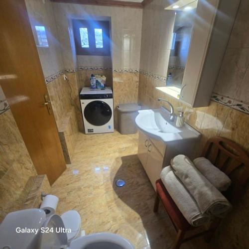 a small bathroom with a sink and a toilet at The Relic in Olympos