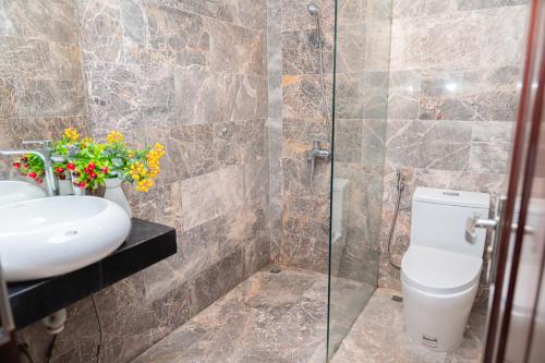 a bathroom with a toilet and a sink at A89 Hotel & Spa Hanoi in Hanoi