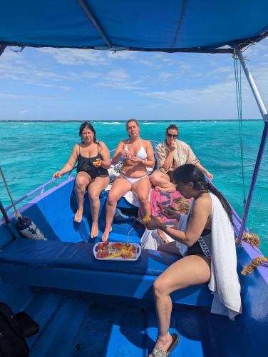 a group of people sitting on a boat in the ocean at PASIFIC OCEAN TOUR's in Wasini Island