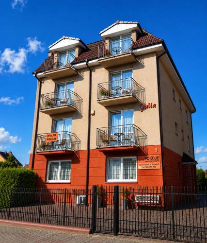 a building with balconies on the side of it at Willa Julia in Rewal