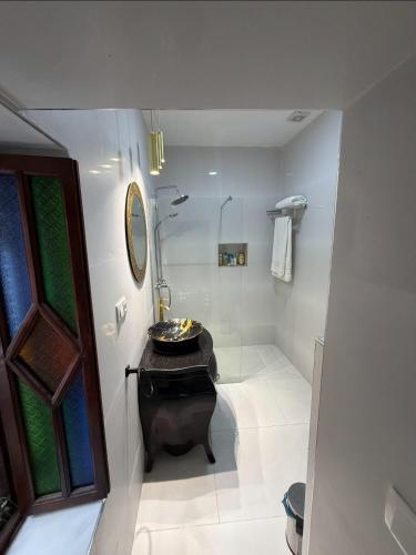 a bathroom with a sink and a shower in it at Sherezade Riad in Tétouan