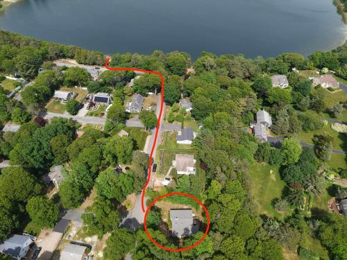 an aerial view of a house with a red at Central AC 3 Min Walk to Pond in Barnstable