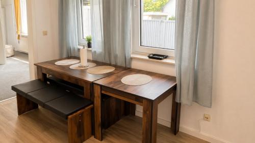a wooden desk in a room with a window at Koblenz Corner Rooms in Koblenz
