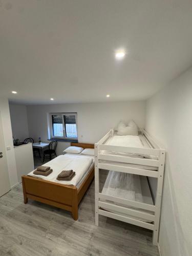a bedroom with two bunk beds in it at Ferienwohnung Manolya in Günzburg