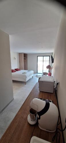 a living room with two beds at L'Arcadia Chambres d'hôtes près de Vaison la Romaine et Mont Ventoux à Crestet in Crestet