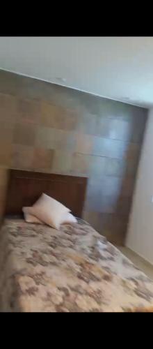 a blurry picture of a bed with a white pillow at دوار الهلال دوار الثقافه in Irbid